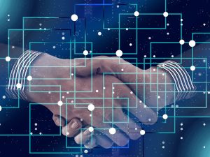 DR. GANADO MODERATES PANELS AT BLOCKCHAIN AND AI CONFERENCE