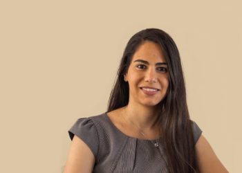 Marylise Sacco as Executive Director